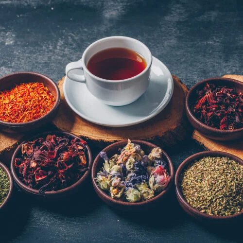tea-herbs-bowls-with-wood-stubs-cup-tea-high-angle-view-dark-textured-background-space-text-2-500x500 tea-herbs-bowls-with-wood-stubs-cup-tea-high-angle-view-dark-textured-background-space-text-2-500x500